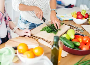 Woman cooking vegetables