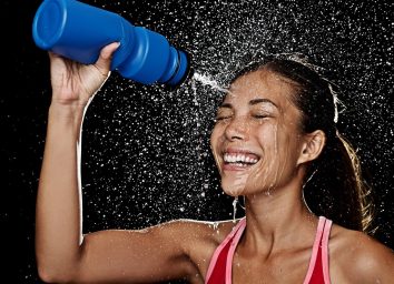 Woman with water bottle after workout
