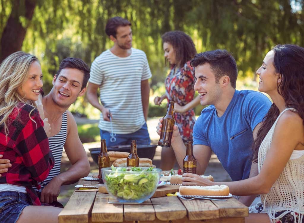 Three couples at picnic table