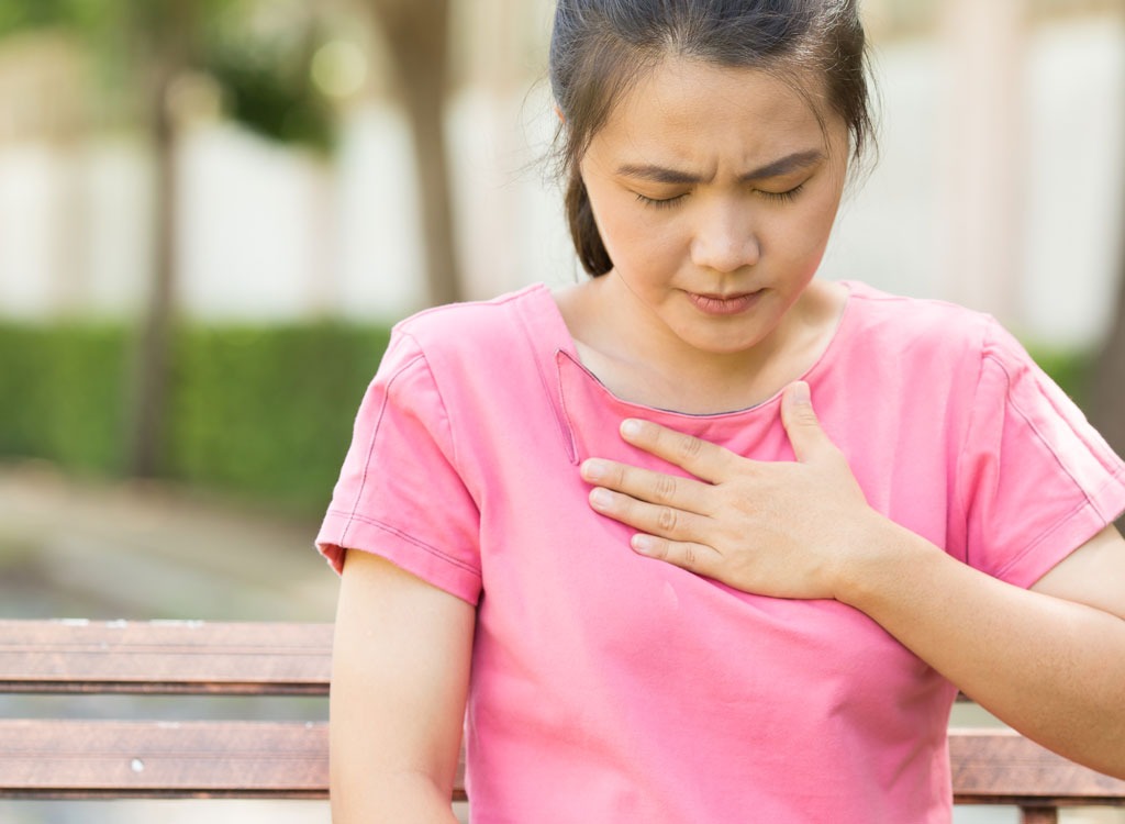 Woman with heartburn