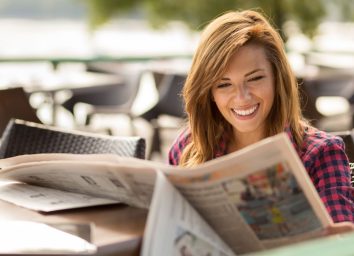 woman reading newspaper