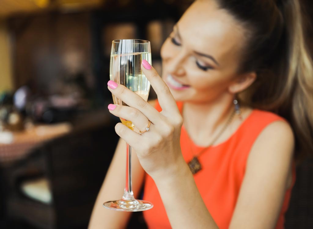 Woman drinking white wine