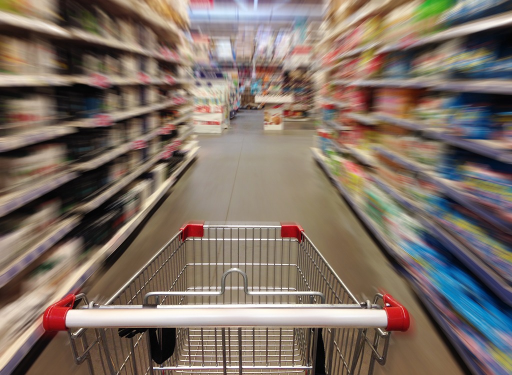 Cart in supermarket aisle