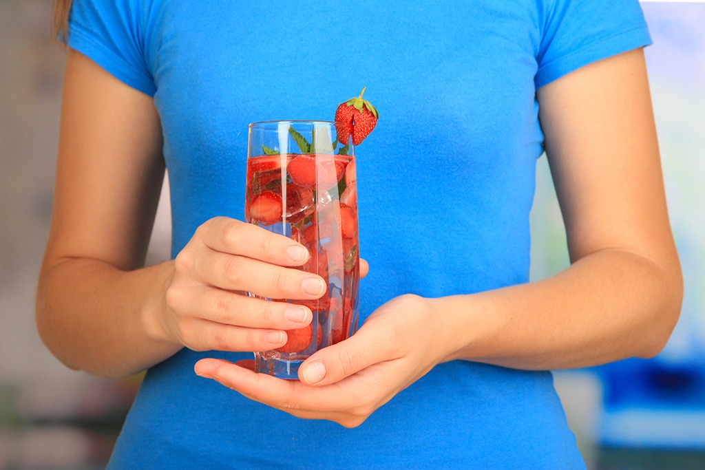Woman holding fruit water.jpg