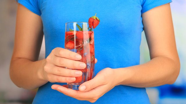 Woman holding fruit water.jpg