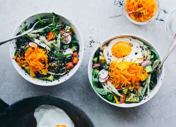 Green salads in bowls with eggs