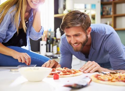 man eating pizza