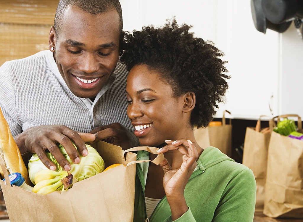 Couple unpacking groceries