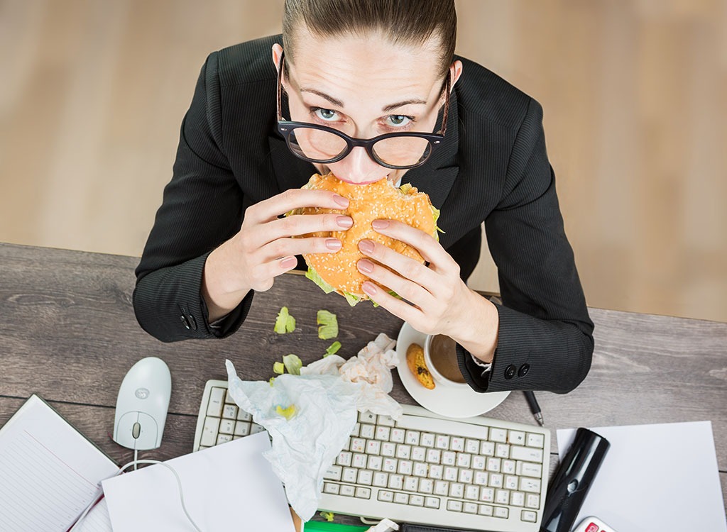 woman eating desk