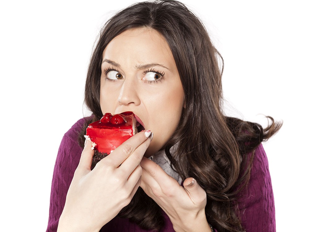 Woman eating cake.jpg