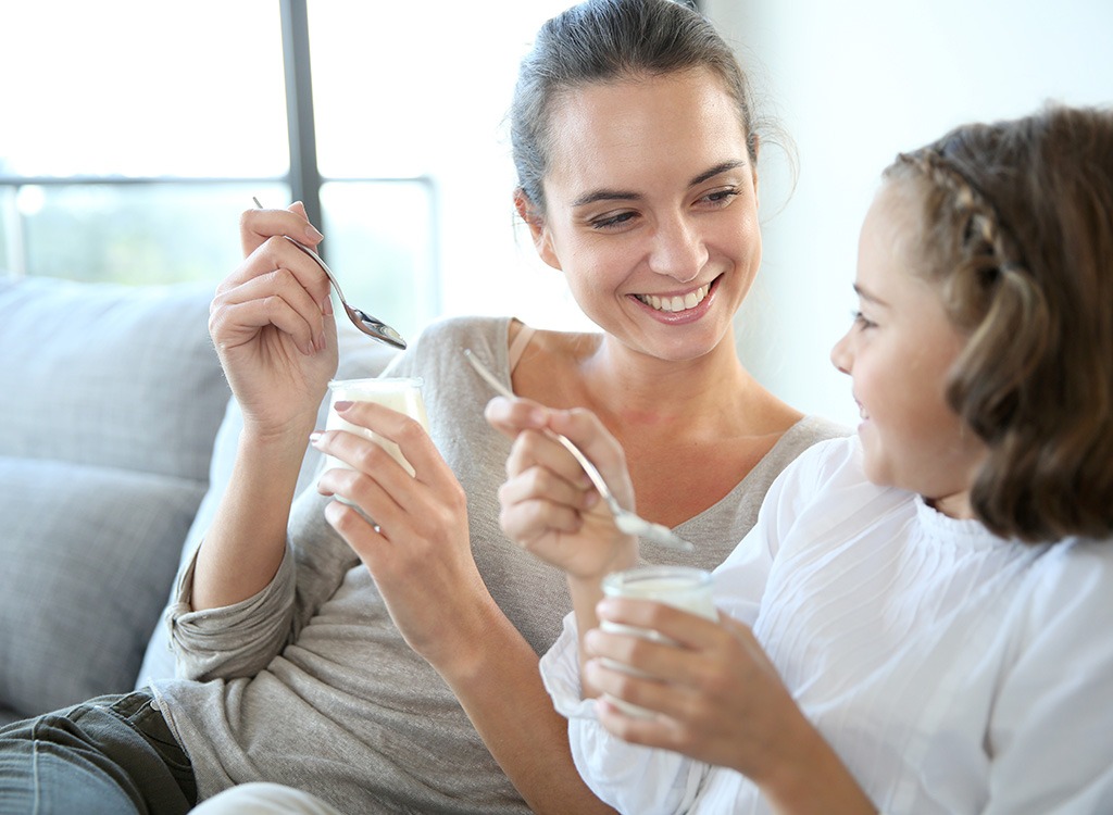 mom and daughter having a snack together