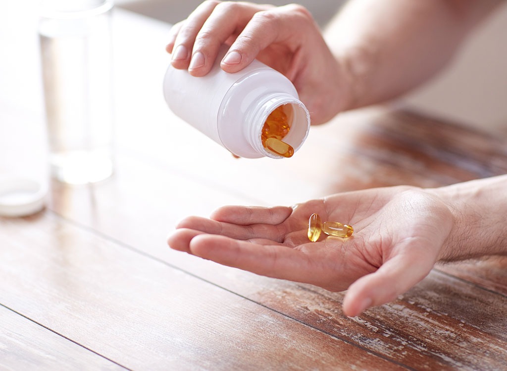 omega 3 fish oil pills in hand