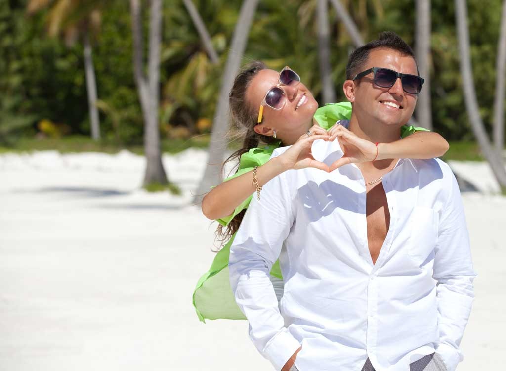 Couple on beach smiling.jpg