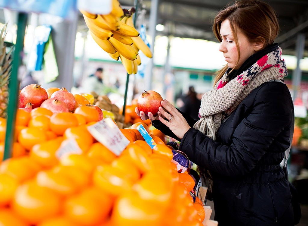 Woman checking produce.jpg