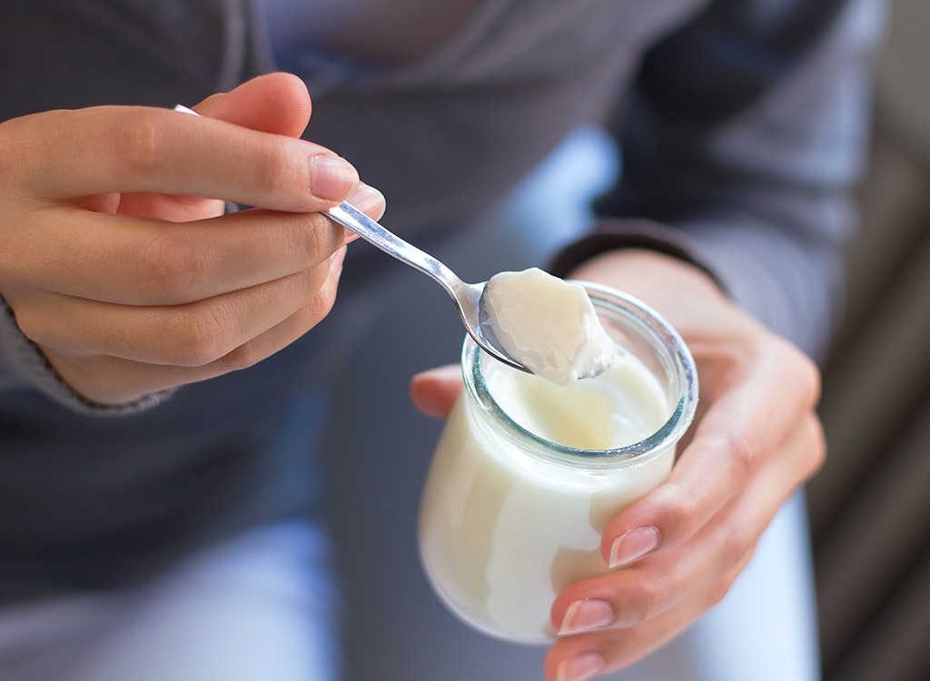 Woman eating yogurt.jpg