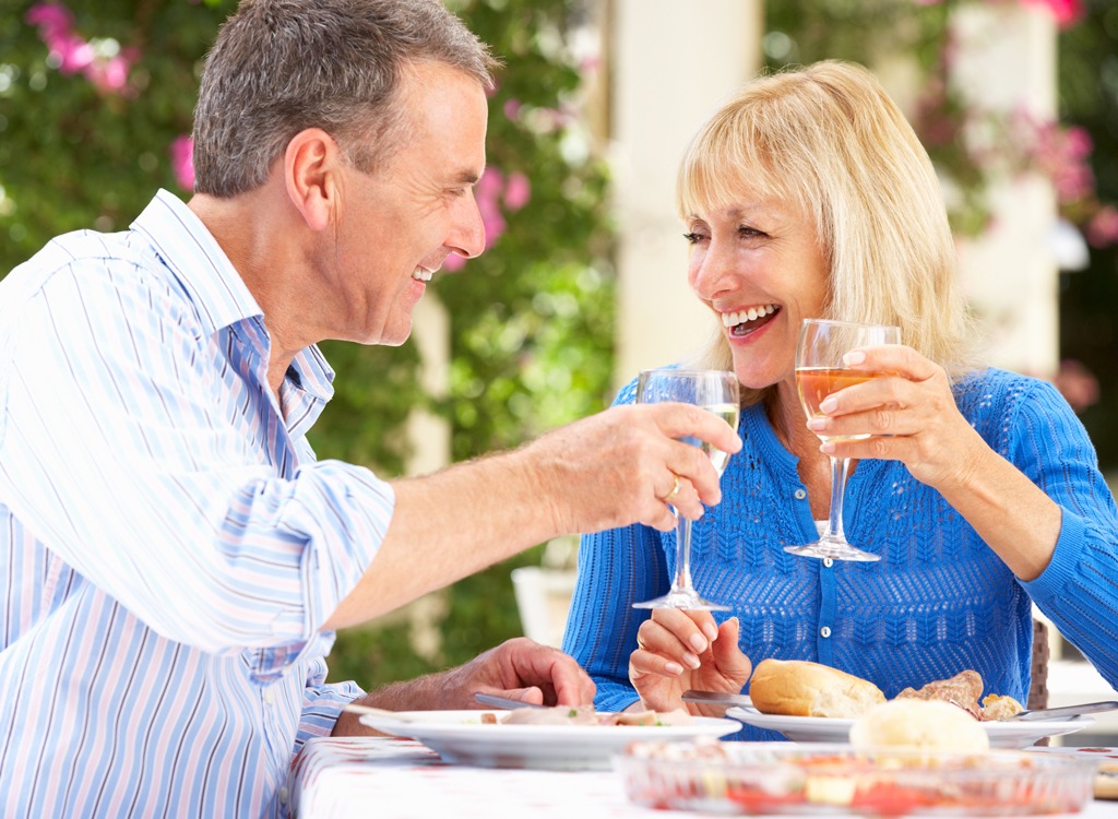 Older man woman drinking wine.jpg