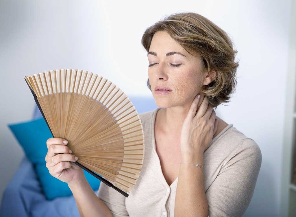 menopausal woman experiencing hot flash