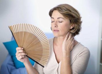 menopausal woman experiencing hot flash