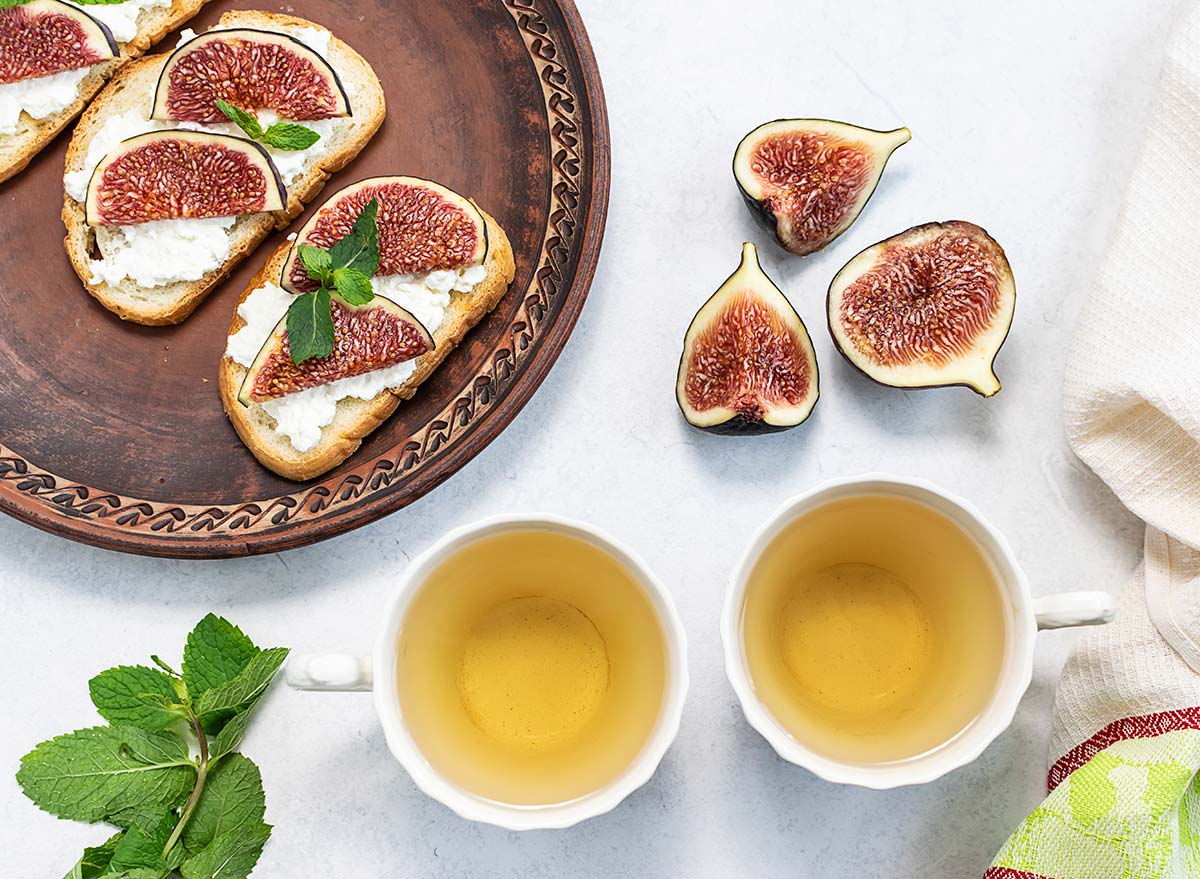 fig toast with cups of green tea