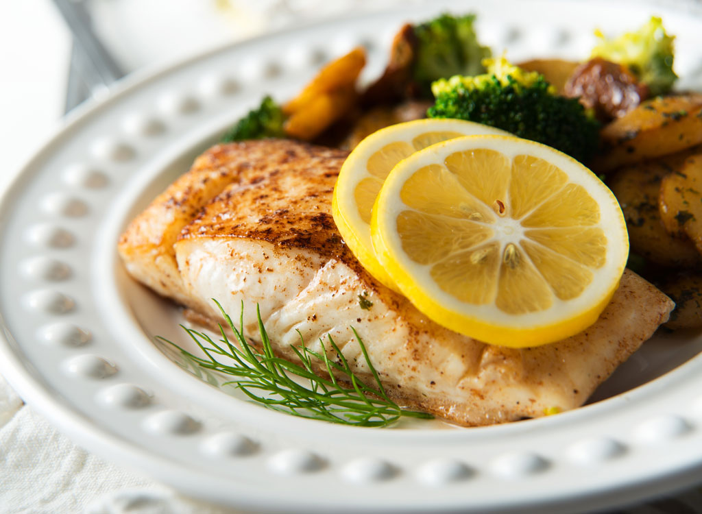 broiled halibut with lemon on plate