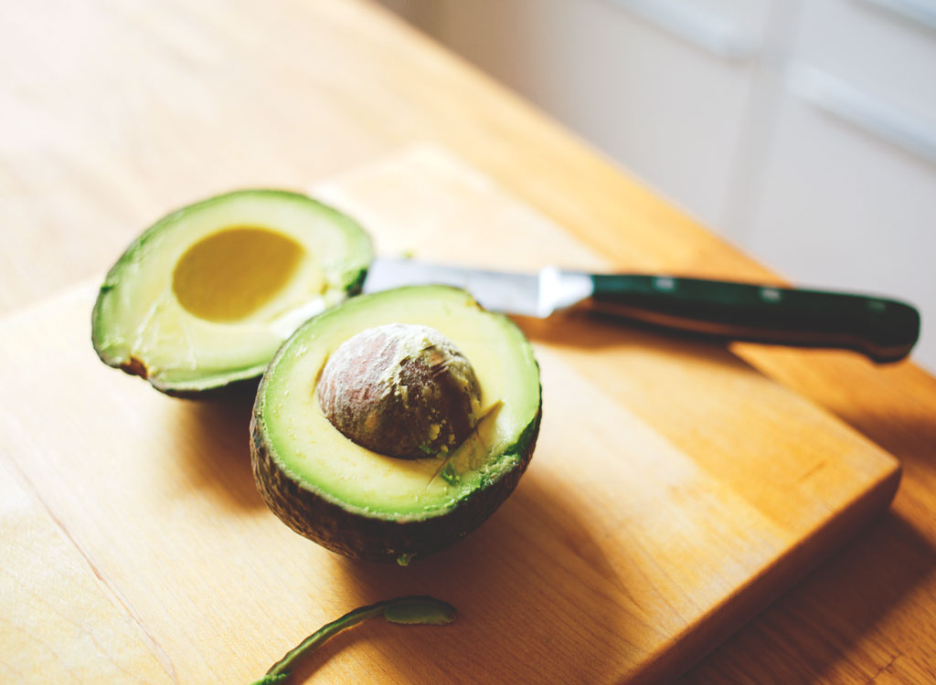 Avocado sliced in half - muscle building foods
