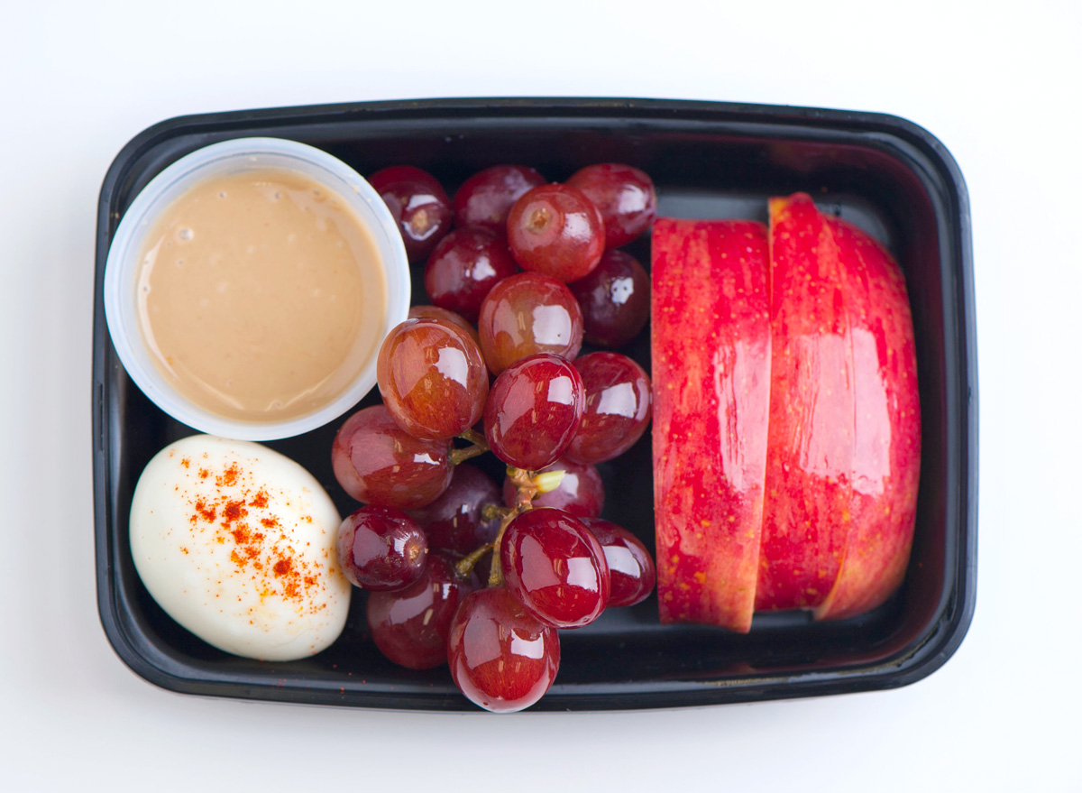protein snack box with peanut butter egg grapes apples