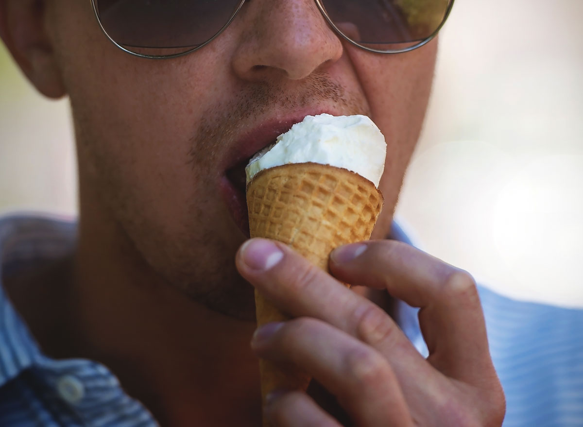 man eating ice cream cone
