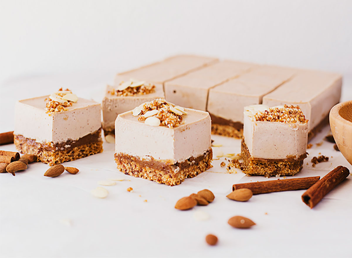 individual squares of almond caramel cheesecake