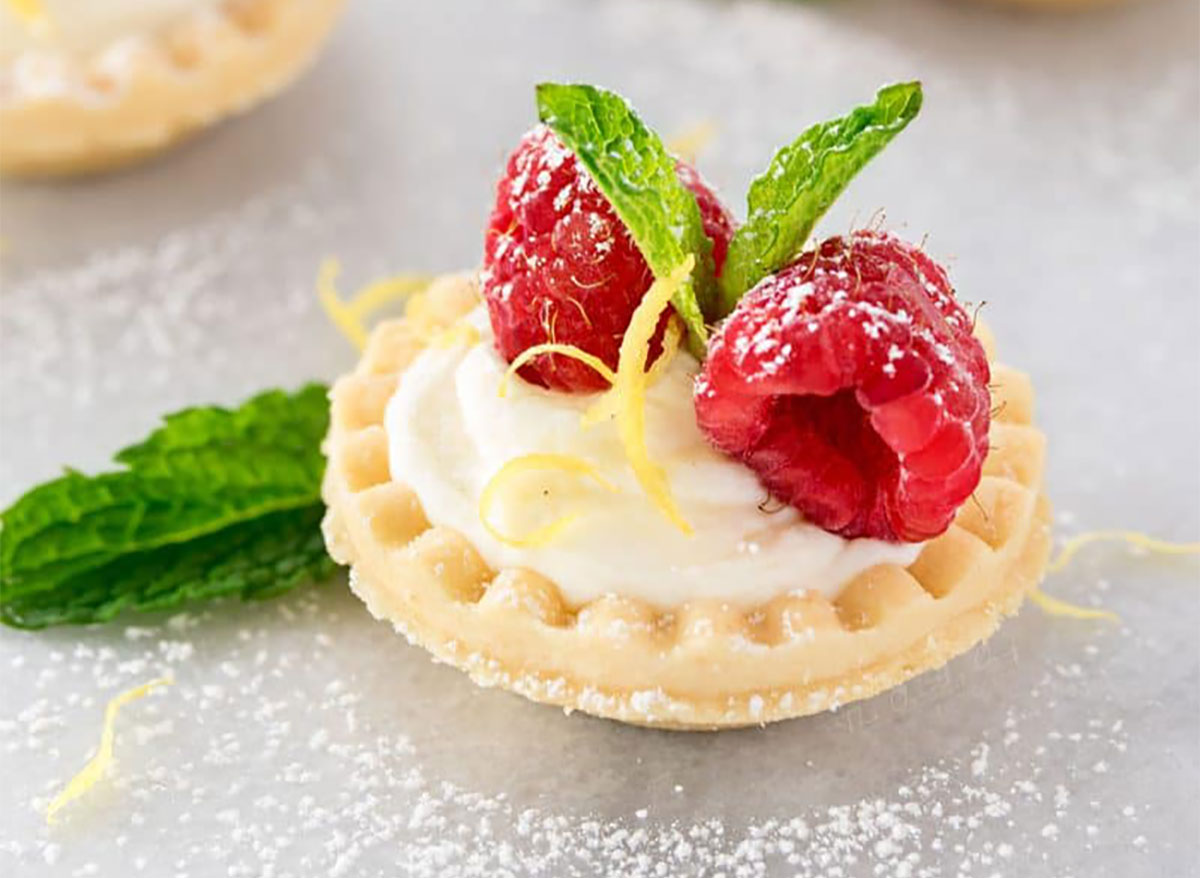 no bake lemon cheesecake tarts topped with raspberries