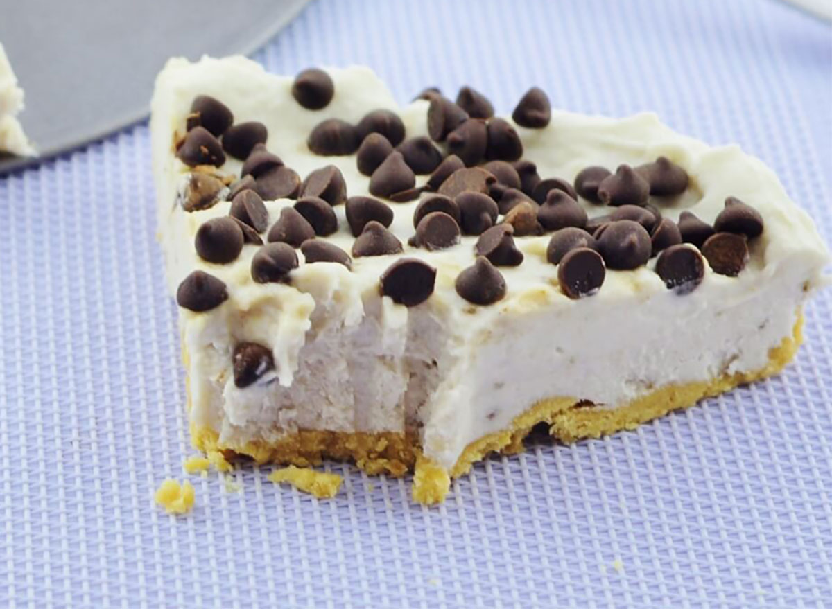 slice of vegan coconut banana cheesecake topped with chocolate chips