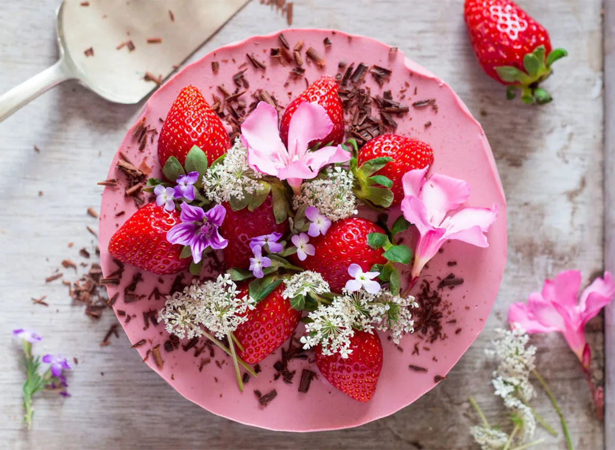 whole vegan strawberry cheesecake topped with flowers