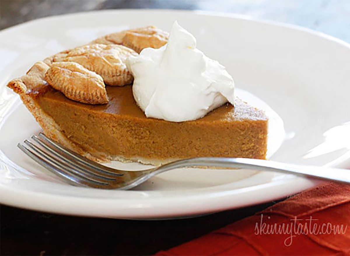 slice of pumpkin pie with whipped cream