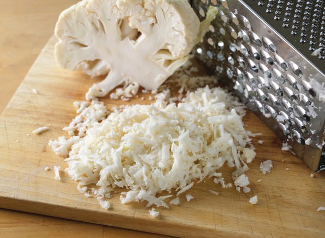 Grating cauliflower into cauliflower rice