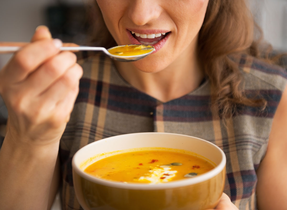 woman eating soup