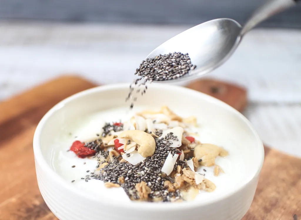 Pour chia seeds on yogurt