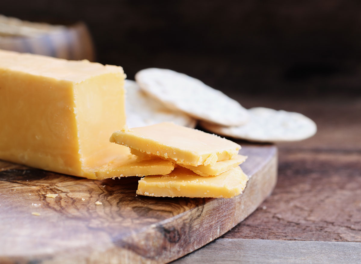 7 Side Effects of Eating Too Much Cheese, According to Experts Eat