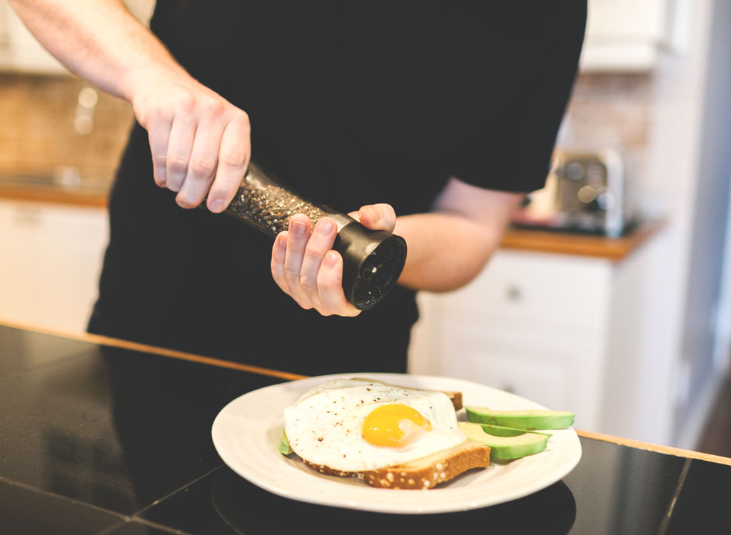 Man grinding pepper