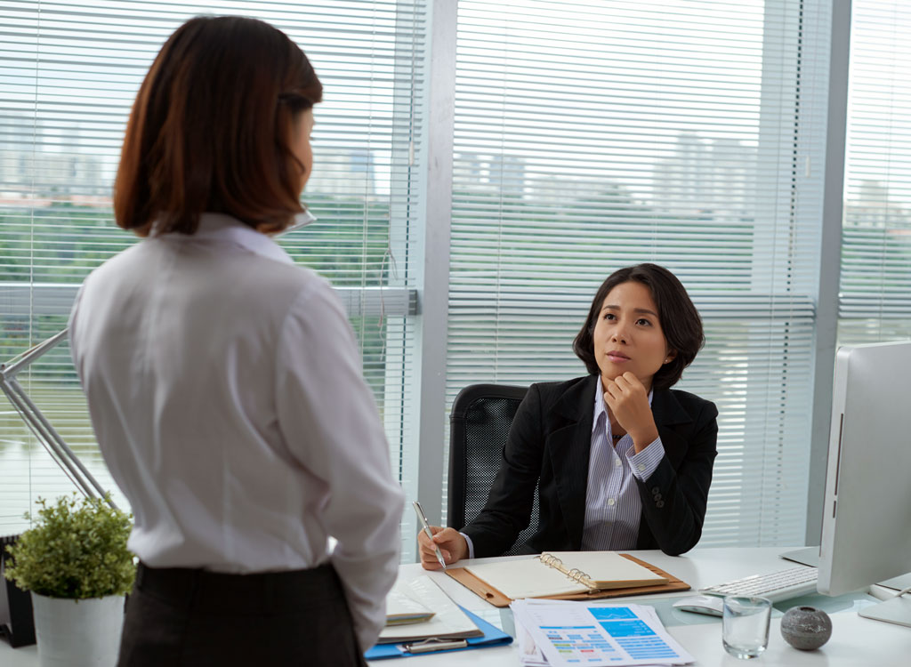 woman confronting boss about personal matter