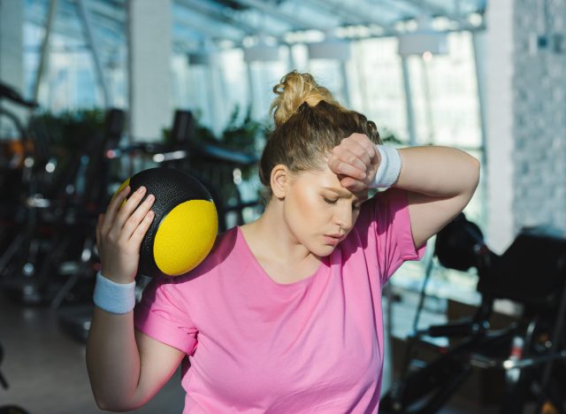 woman sweating and tired after exercising
