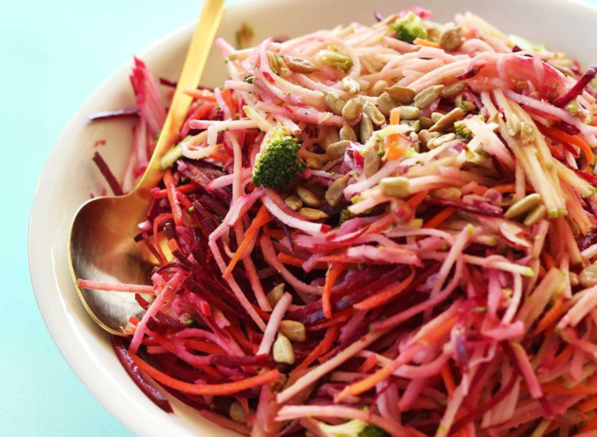 Fall Slaw in a bowl with a golden spoon