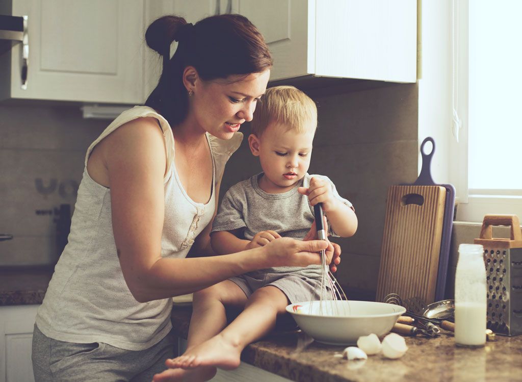 Busy mom cooking with child