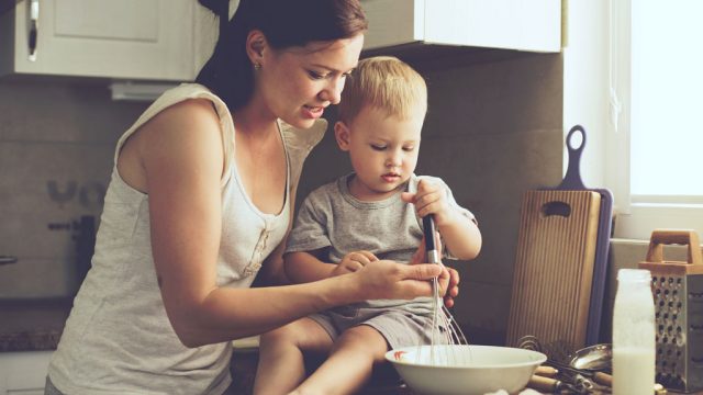 Busy mom cooking with child