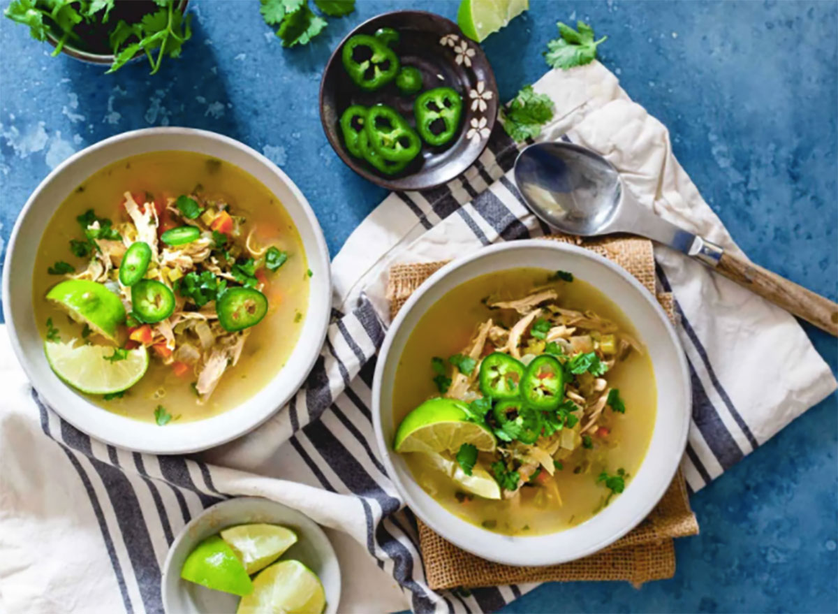 two bowls of chicken and lime soup