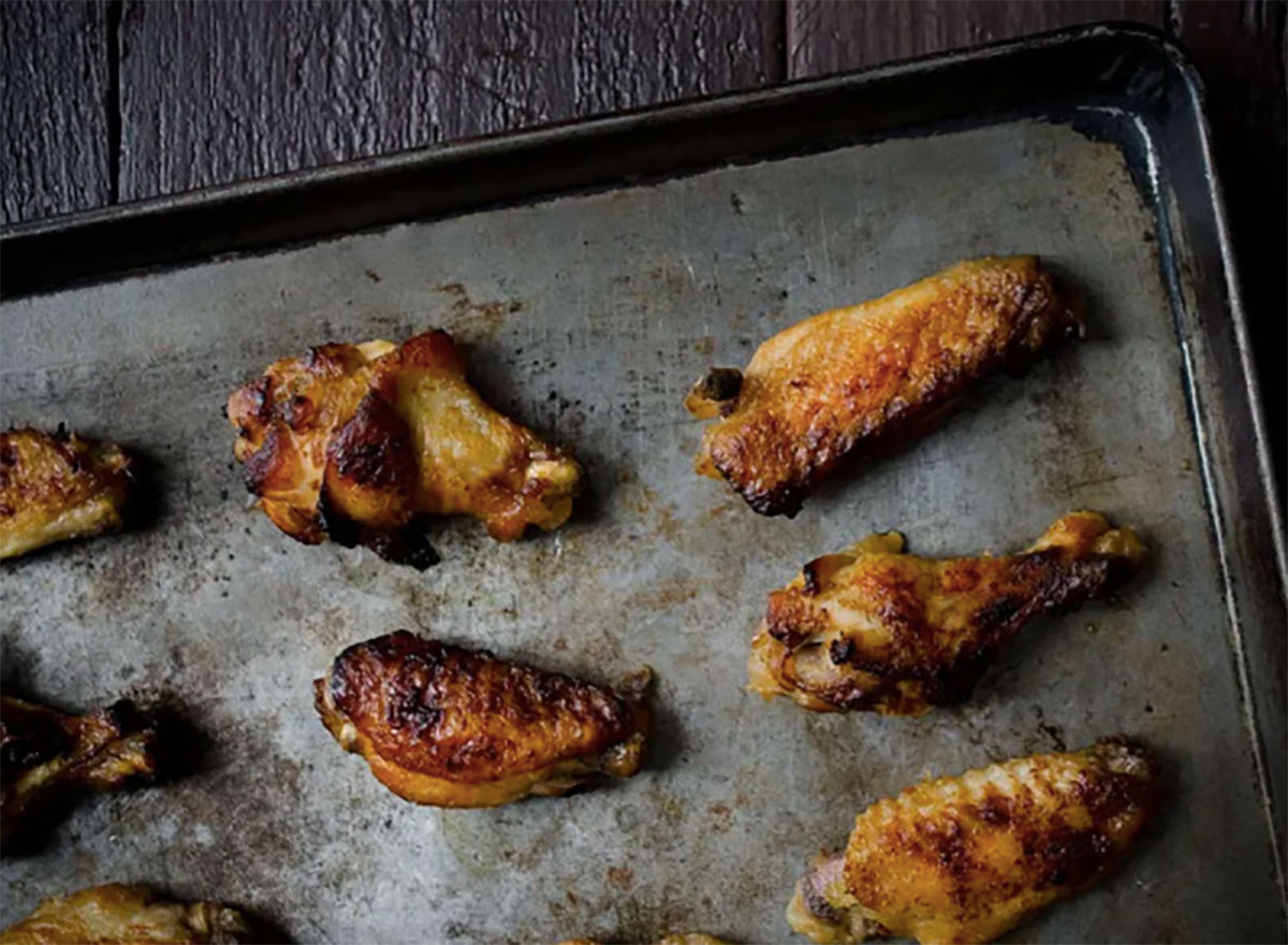 honey garlic chicken wings on baking sheet