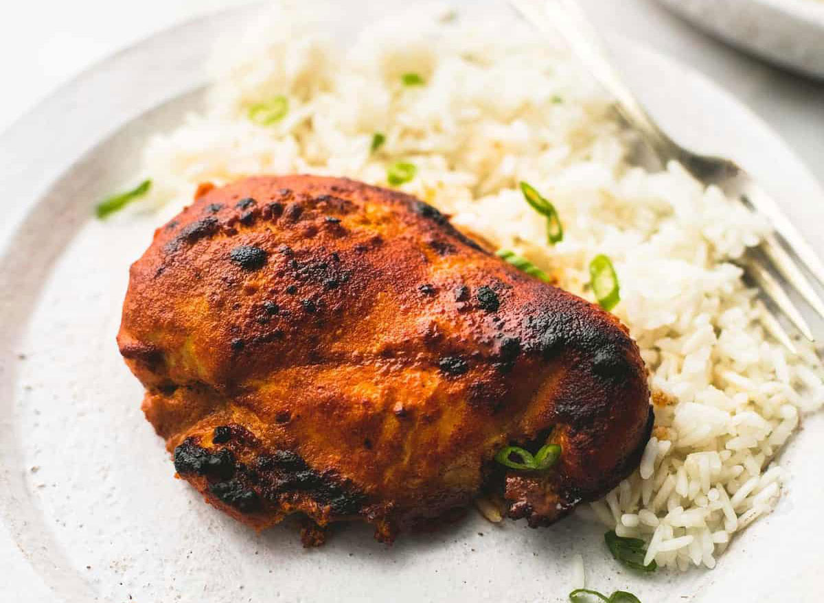 tandoori chicken with rice on a plate