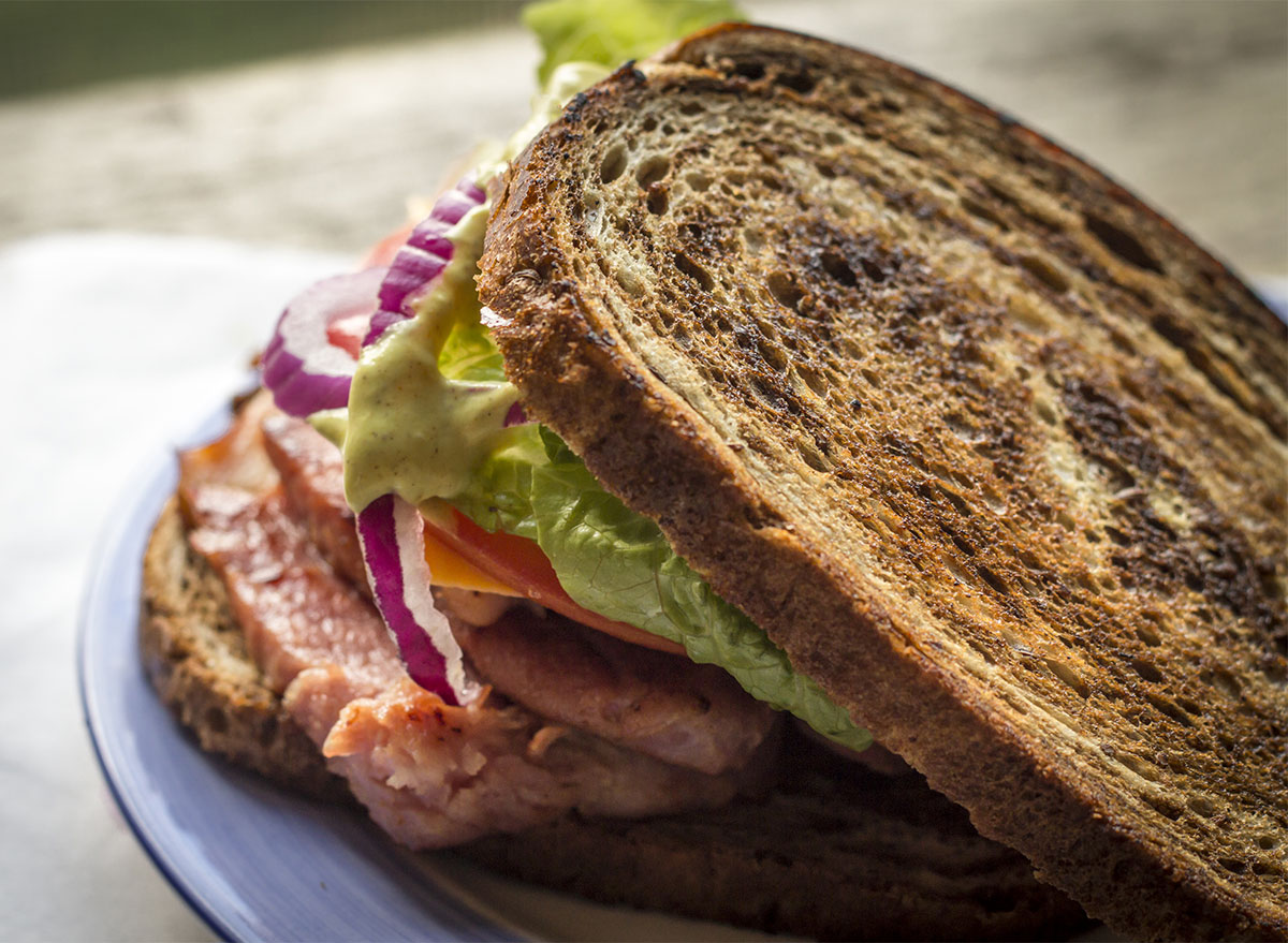 ham sandwich on pumpernickel bread