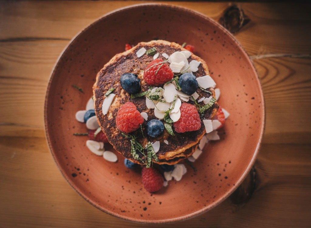 Pumpkin pancakes coconut flakes berries mint