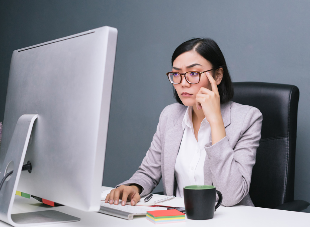 Woman working at desk - always hungry reasons