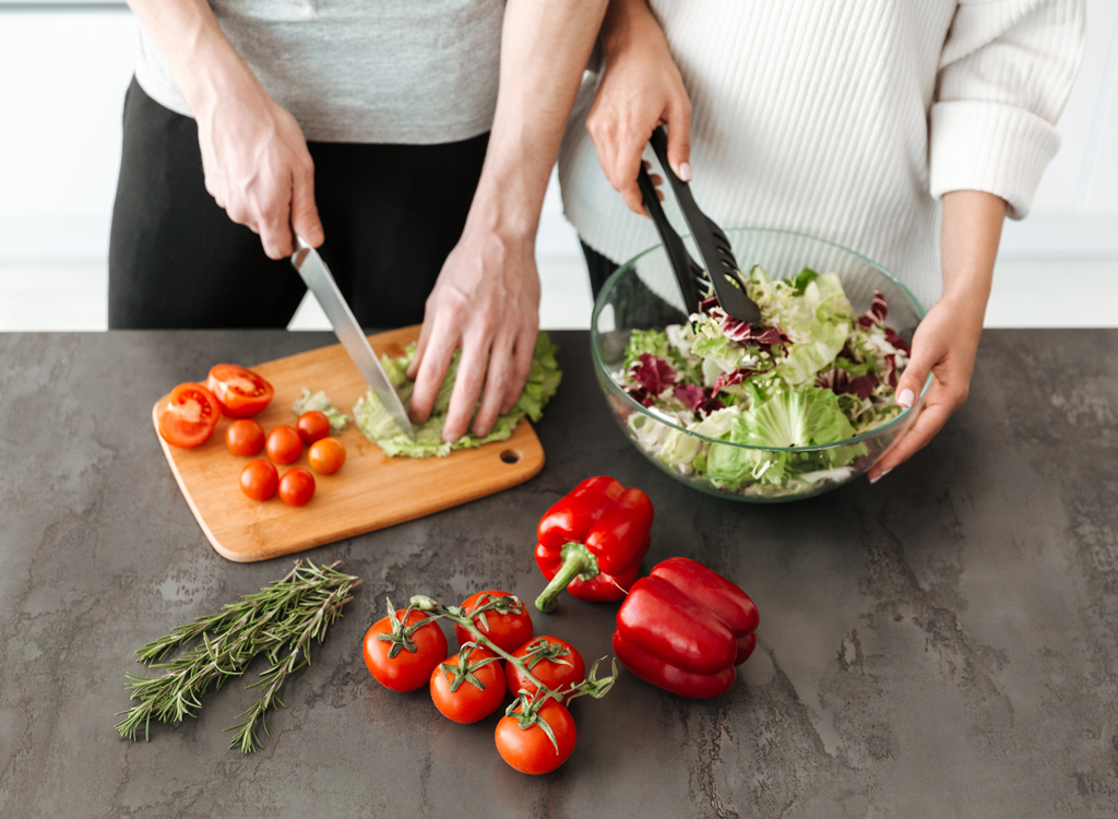 Couple making salad