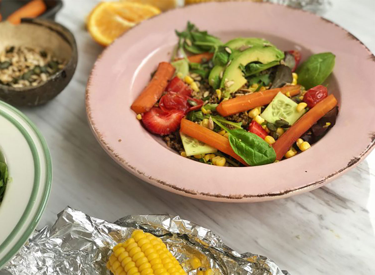 summer barbecue salad with avocado in bowl